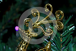 A golden deer in Christmas tree photo