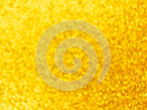 Golden defocus lights background. Festive abstract swirling bokeh