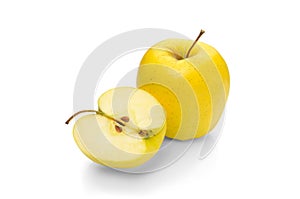 Golden Delicious apple on a white background