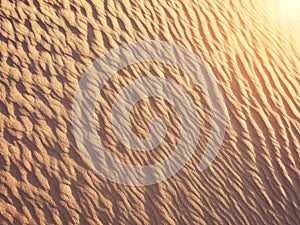 Golden desert sand during sunset as background