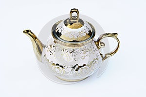 A golden designed kettle with white background.