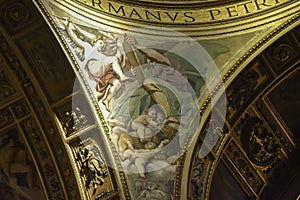 Golden detail of the interior of the Basilica of Sant`Andrea della Valle, a place of Catholic-Roman worship.