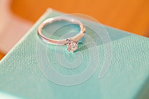 Golden diamond engagement ring on the box