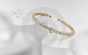Golden and diamond heart shape bracelet on white background