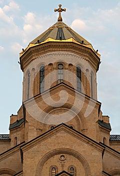Golden dome of the Holy Trinity Cathedral of Tbilisi Tsminda Sameba in Georgia photo