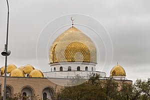 Golden dome with the moon on the Beket Ata mosque in the city of Aktau