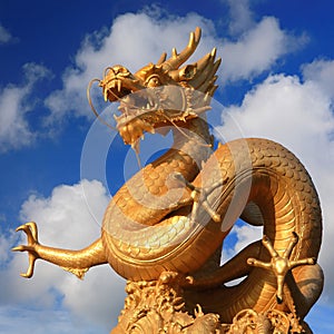 Golden dragon with clear blue sky