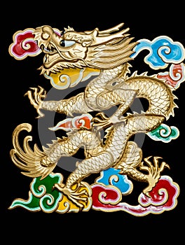 Golden dragon with colorful clouds black background photo