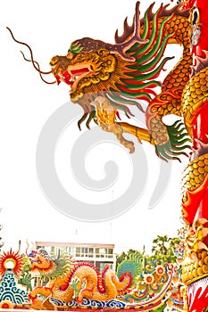 Golden dragon statue on pillar