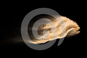 Golden dry river sand explosion isolated on white background. Abstract sand splashing