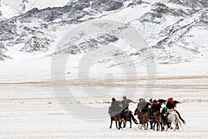 Golden eagle festival in winter snowy Mongolia photo