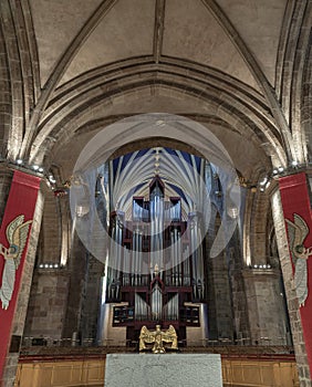 Golden eagle on a globe with a Church organ of The thistle chapel in St Giles' Cathedral or the High Kirk