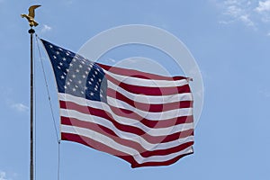 Golden eagle Usa American flag stars and stripes on sky background