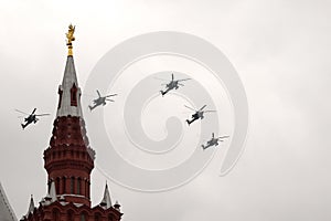 The Golden Eagles aerobatic team on Mi-28N attack helicopters in the sky over Moscow`s Red Square during the Victory Air Parade
