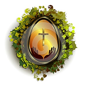 Golden Easter egg with a cross and a wreath of leaves