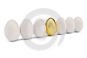 Golden egg around white eggs in row. Golden egg closeup. Golden egg as a sign of wealth, luxury. Egg as a symbol of