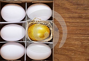 Golden egg and white eggs