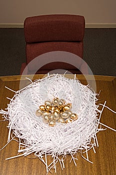 Golden eggs in a paper nest