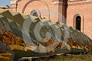 Golden elements of the dome close-up on the background of the construction site, horizontal photo