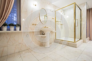 Golden elements inside bathroom