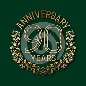 Golden emblem of ninetieth years anniversary. Celebration patterned logotype photo