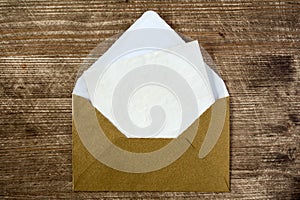 Golden envelope with blank letter