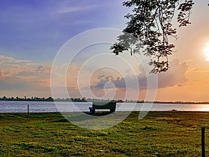 Golden evening in the moment of sunset in front of Padma river