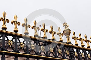 Golden fleur de Lis on the gates of Buckingham Palace, London, UK