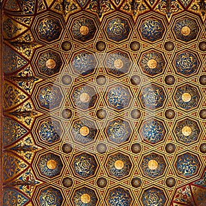 Golden floral pattern decorations of ceiling of Mausoleum of Sultan Qalawun, Medieval Cairo, Egypt photo