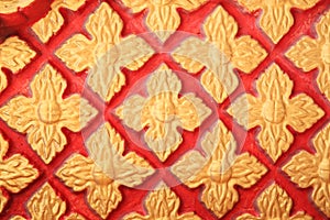 Golden Floral pattern on red wall