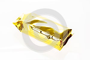 Golden foil bag package on white background.