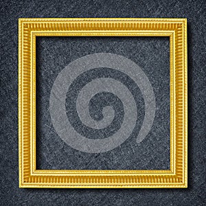 A golden frame on Dark grey black slate background or texture