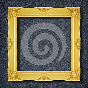 A golden frame on Dark grey black slate background or texture