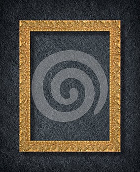 A golden frame on Dark grey black slate background or texture