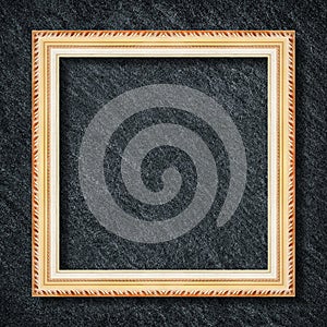 Golden frame on dark grey black slate background or texture