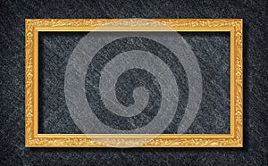 Golden frame on Dark grey black slate background or texture