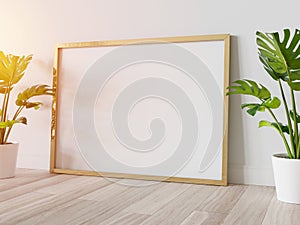 Golden frame leaning on floor in interior mockup. Template of a picture framed on a wall 3D rendering