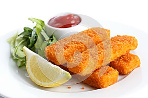 Golden fried fish fingers with lemon and tomato sauce