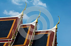 Golden gable apex on the roof of Thai temple, Bangkok.