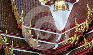 Golden gable apex on the roof of Thai temple, Bangkok.