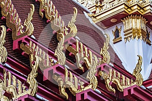 Golden gable apex on the roof of Thai temple, Bangkok.