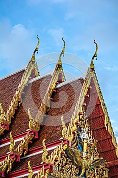 Golden gable apex on the roof of Thai temple, Bangkok.