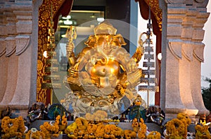Golden Ganesha god statue in front of the Central World Plaza, Bangkok, Thailand.