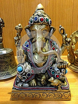 Golden Ganesha statue with ornaments