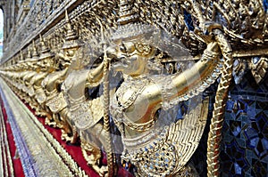 Golden garuda figures on exterior building of Wat Phra Kaew, Bangkok
