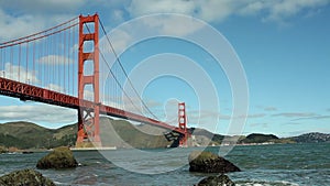 Golden Gate bridge and bay with waves