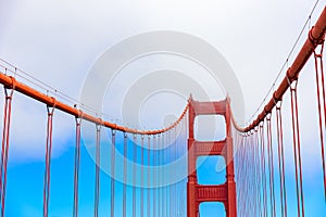 Golden Gate Bridge on a beautiful sunny day with blue sky and clouds in summer - San Fancisco Bay Area,  Golden Gate National