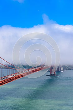 Golden Gate Bridge in clouds on a beautiful summer day  - Panoramic view from Battery Spencer - California, USA
