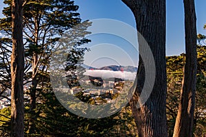 Golden Gate Bridge peeks out from the fog in San Francisco