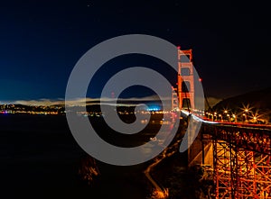 Golden gate bridge San Francisco at night with car lights trails